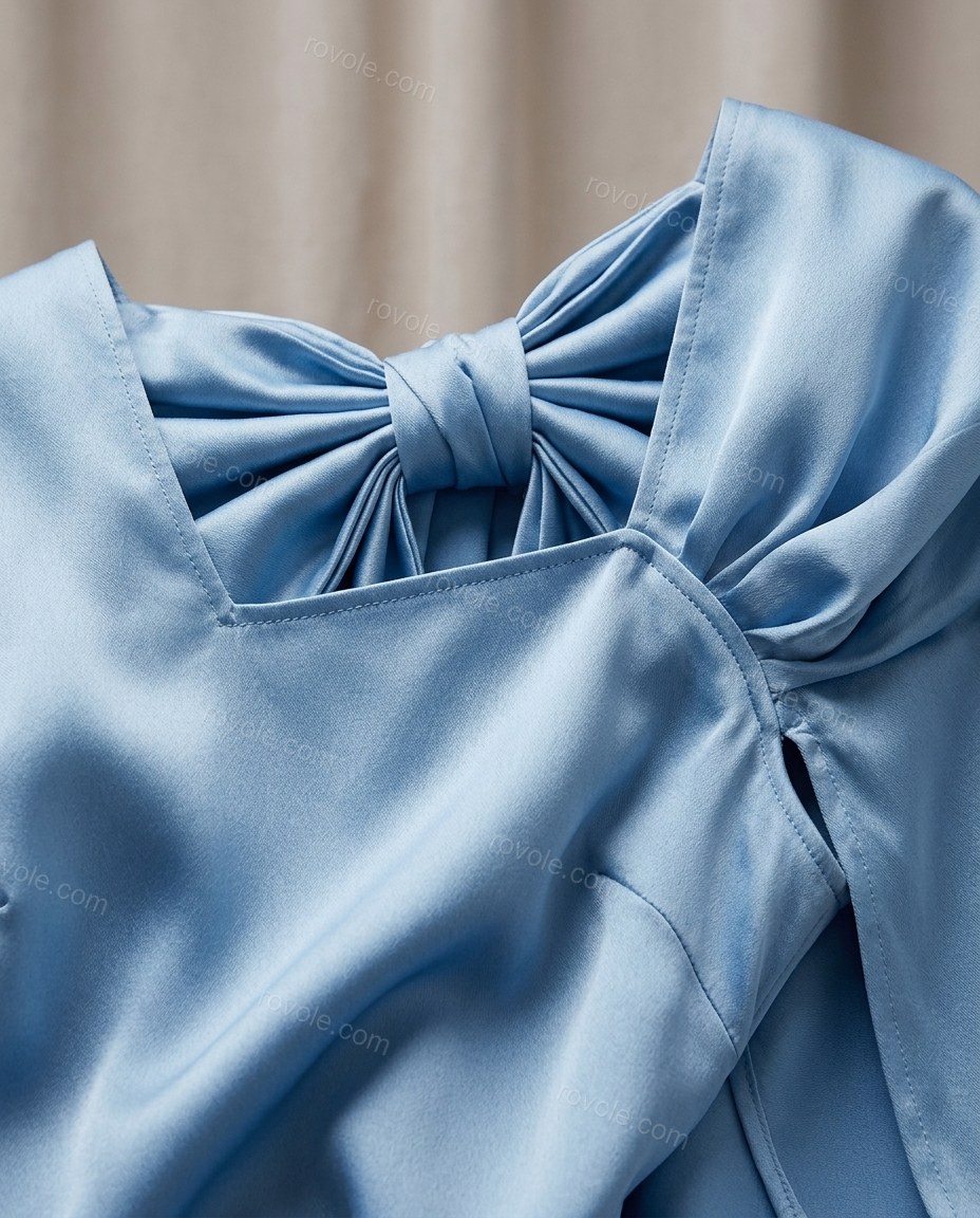 Light Blue Mini Cape Satin Dress, close-up of cape overlay, back bow detail and square neckline, by rovole.com