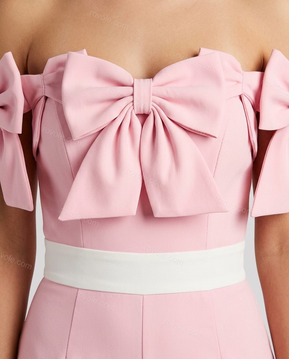 Pink Off-Shoulder Jumpsuit, close-up of white accents, bows on sleeves and contrasting waistband, by rovole.com