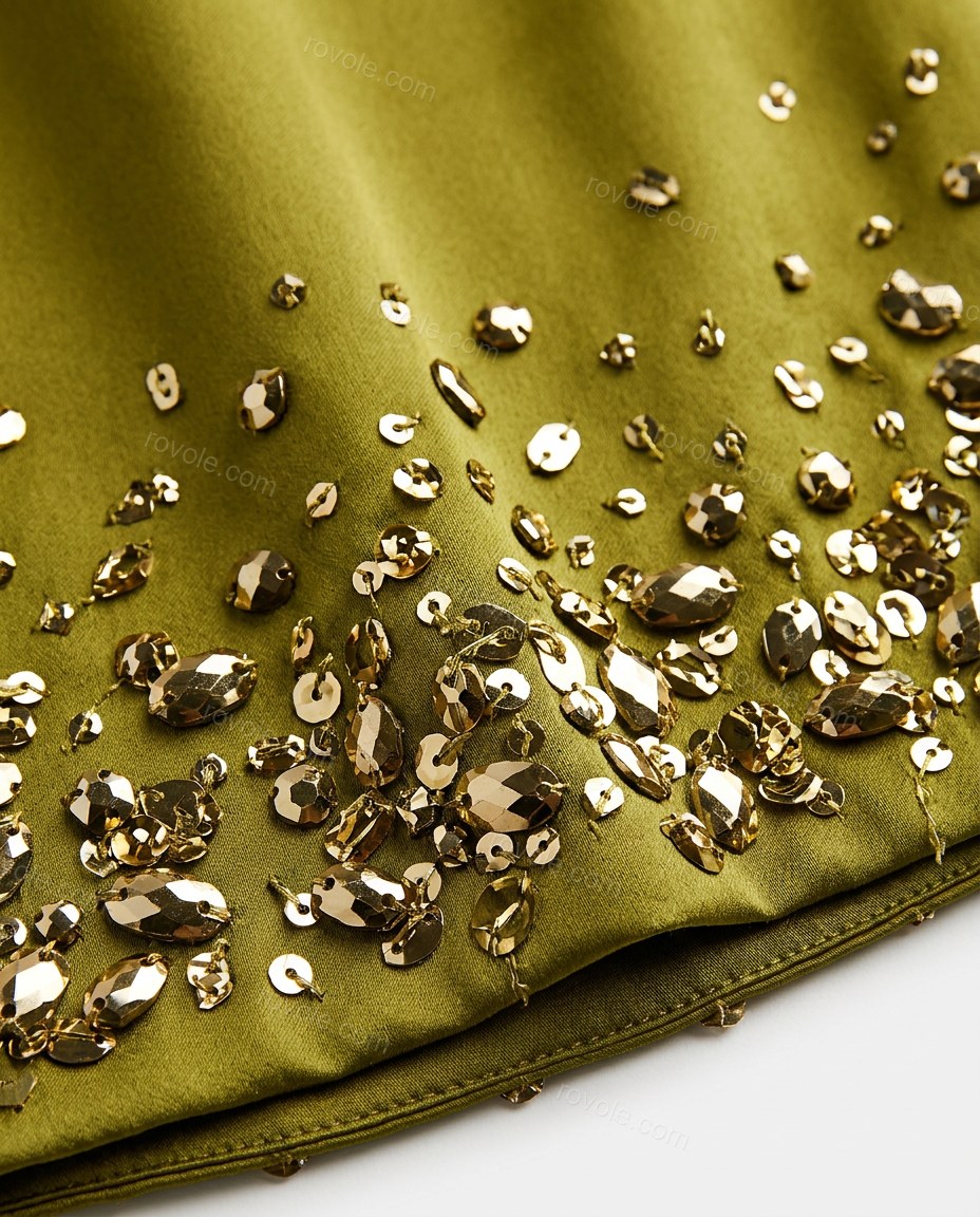 Olive Green Mini Open-Back Halter Dress, close-up of gold accents, embellished neckline and embellished hem, by rovole.com