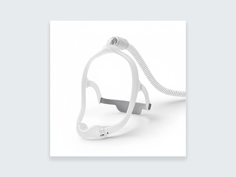 {"default":"Under-the-nose CPAP mask with top-of-head tube connection on white background"}
