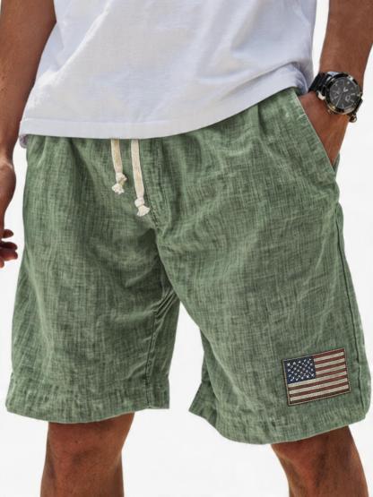 Men's Breathable Linen Embroidered Logo Loose Holiday Shorts