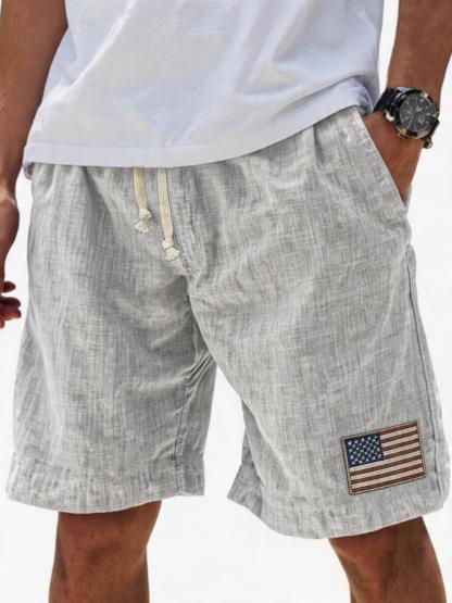 Men's Breathable Linen Embroidered Logo Loose Holiday Shorts