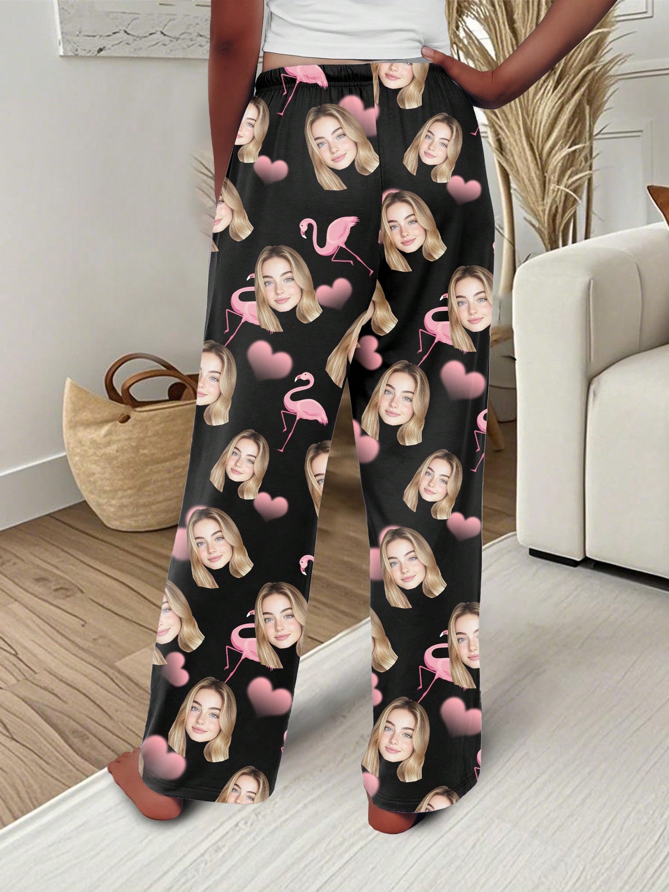 Custom-designed pajama pants with a portrait of a person, featuring a flamingo and heart print; sweet-style custom pajamas.