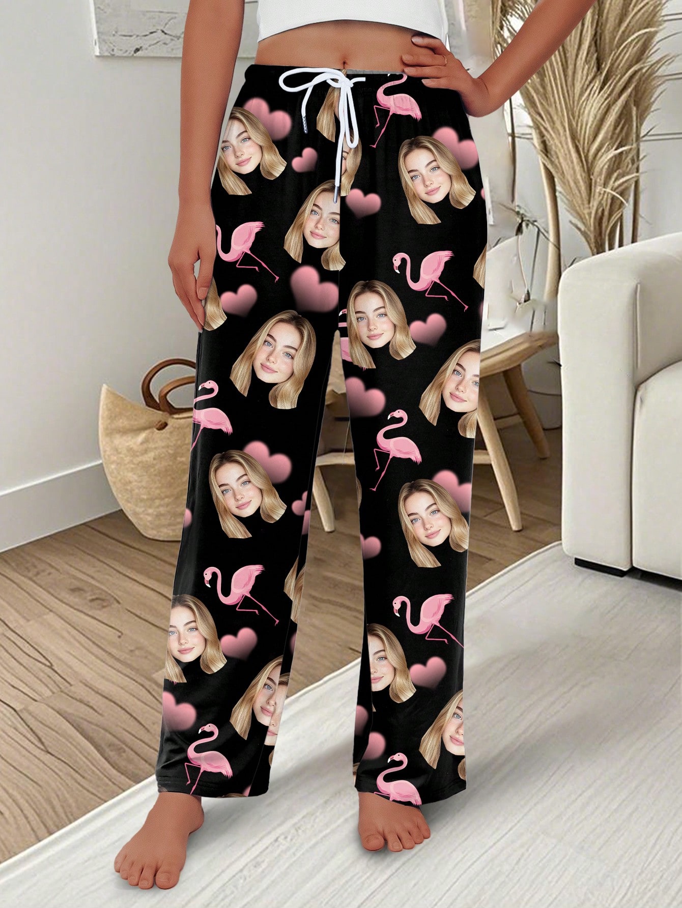 Custom-designed pajama pants with a portrait of a person, featuring a flamingo and heart print; sweet-style custom pajamas.