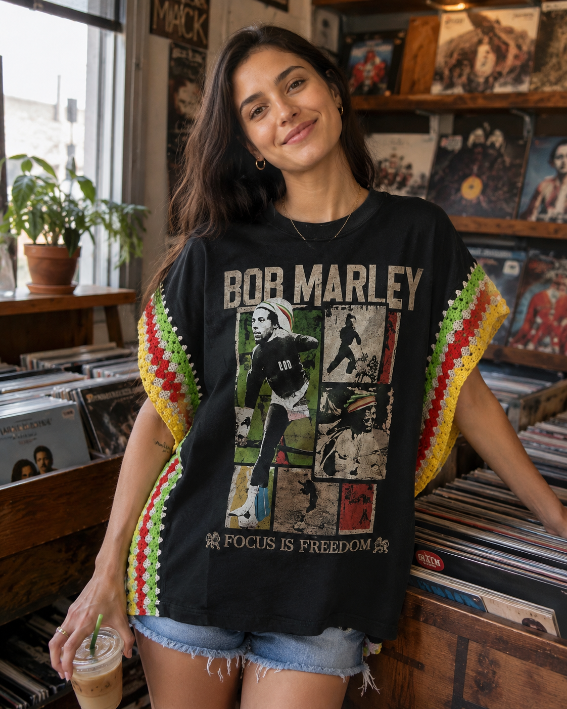 Woman wearing a handmade crochet-side vintage graphic tee in a record store