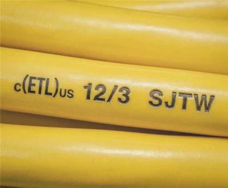 Close-up of Vantecable 12/3 SJTW extension cord jacket marking, showing crisp c(ETL)us certification and specification text on yellow PVC sheathing.