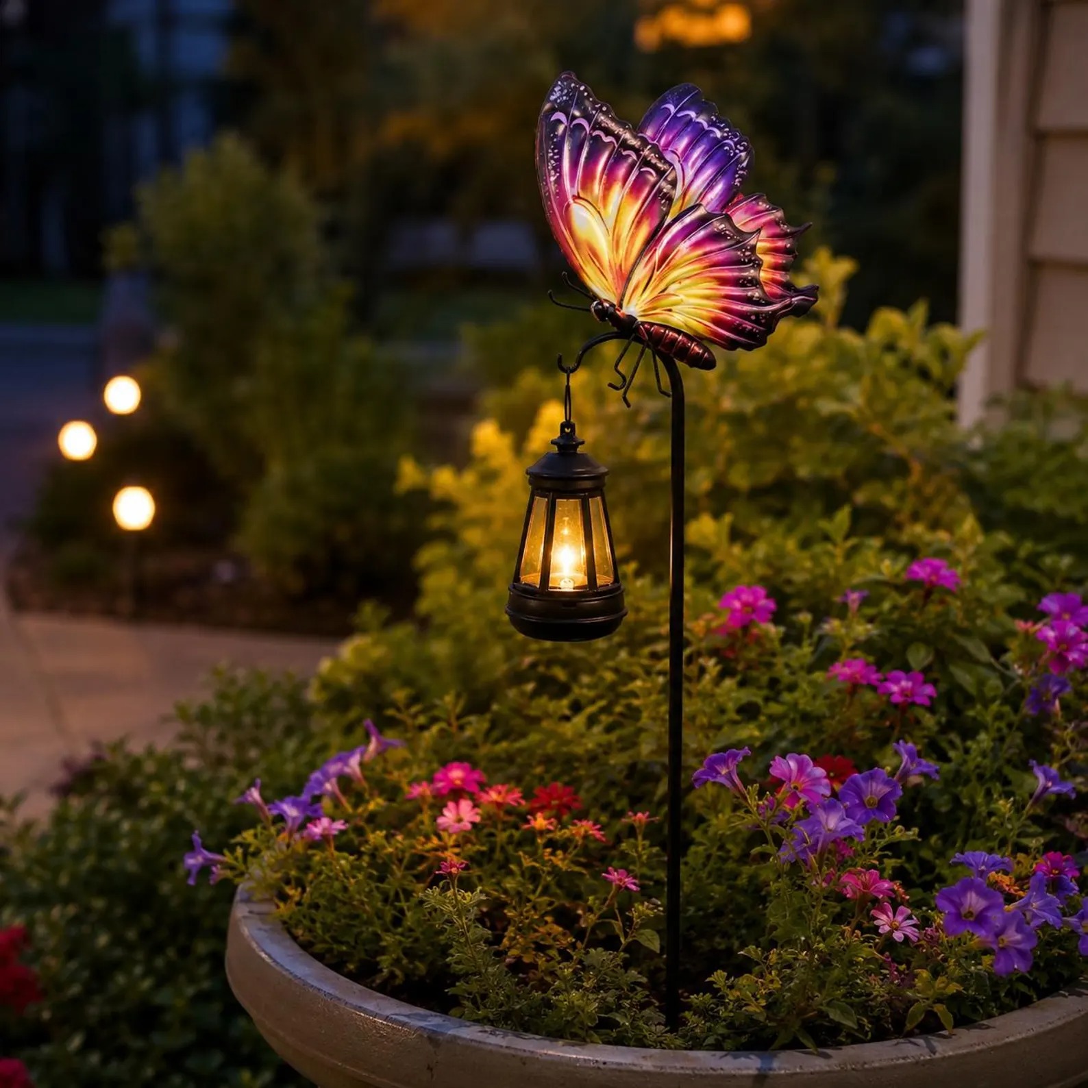 Original product photograph showing the warm hanging lantern in a flower planter