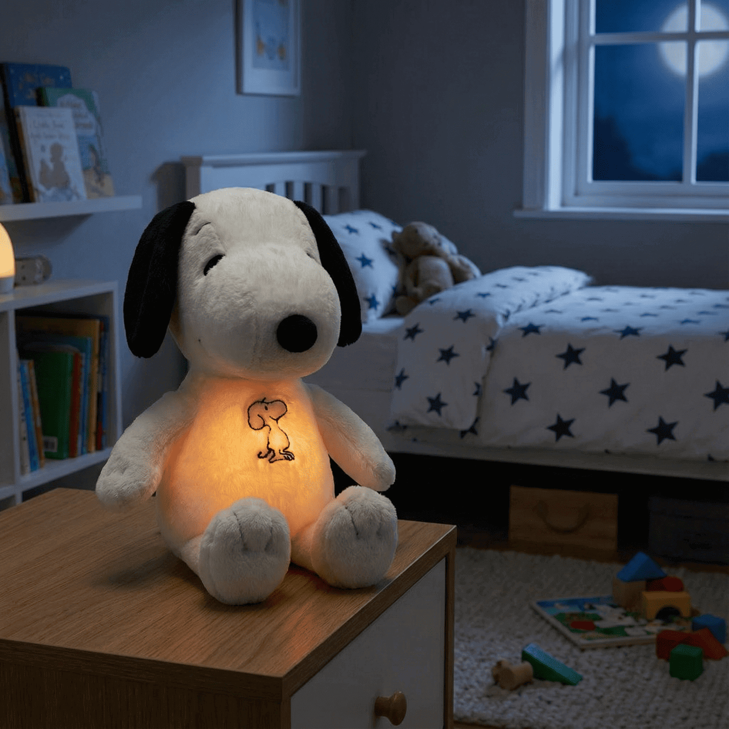 Snoopy plush with its warm belly light on beside a bed