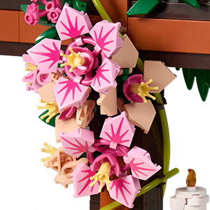 Close-up of pink flower and green leaf details on the Jesus cross building set