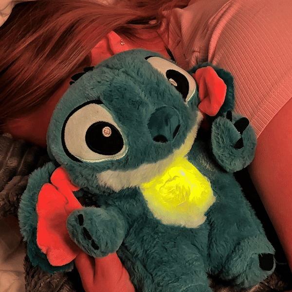 Breathing plush toy demonstrating the gentle moving-belly feature