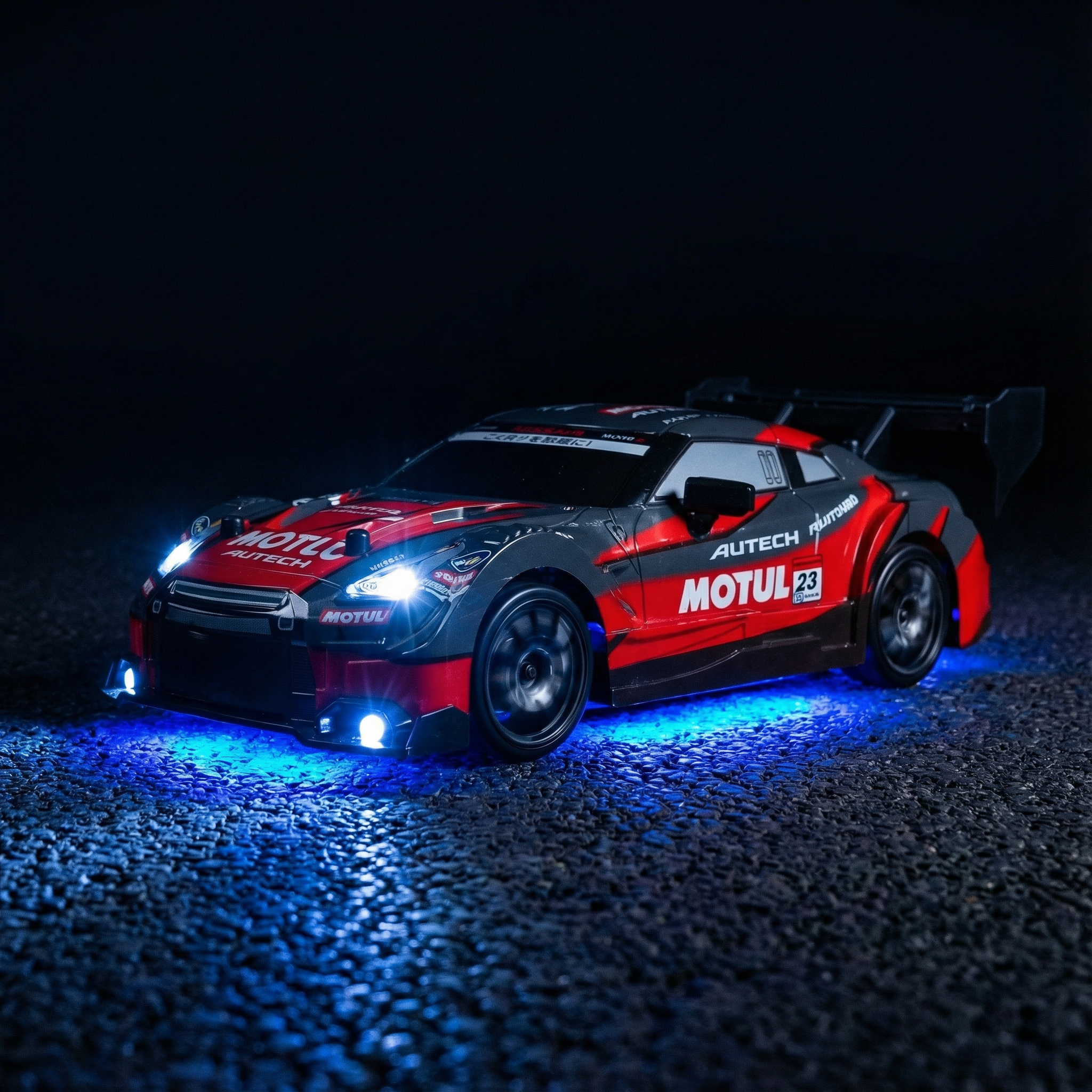 Red and black RC drift car with illuminated headlights and blue underbody lighting