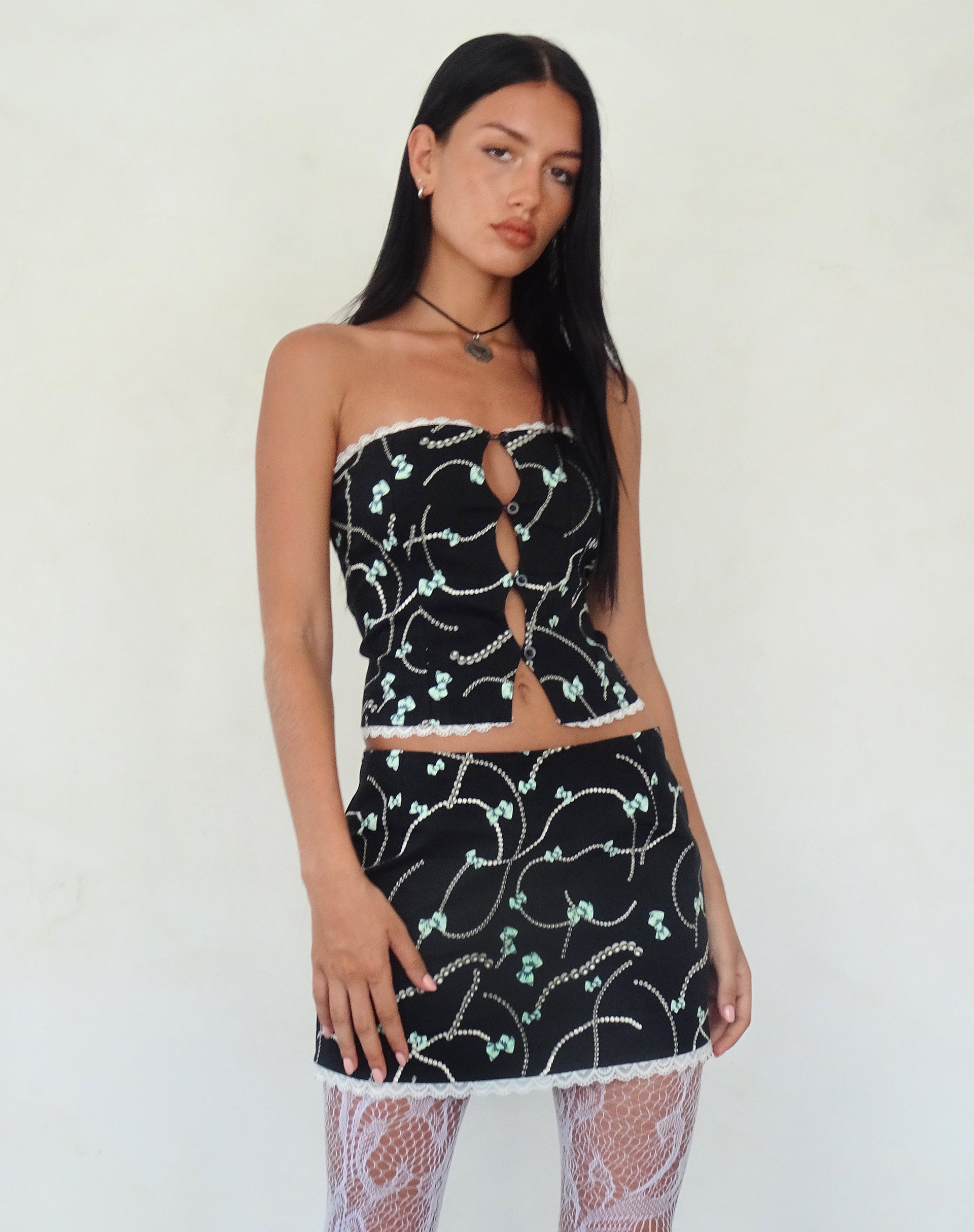 Molen Mini Skirt in Black with Pearl and Bow Print-Nico Sky