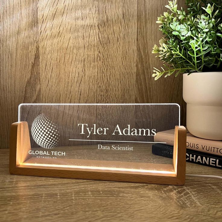 Transform your office or desk into a stylish, personalized space with our&nbsp;custom LED acrylic desk plaques. Featuring a unique wooden base and illuminated with soft LED lights, these plaques seamlessly blend modern elegance with rustic charm. Perfect for adding a personal touch to any workspace or as a thoughtful gift.