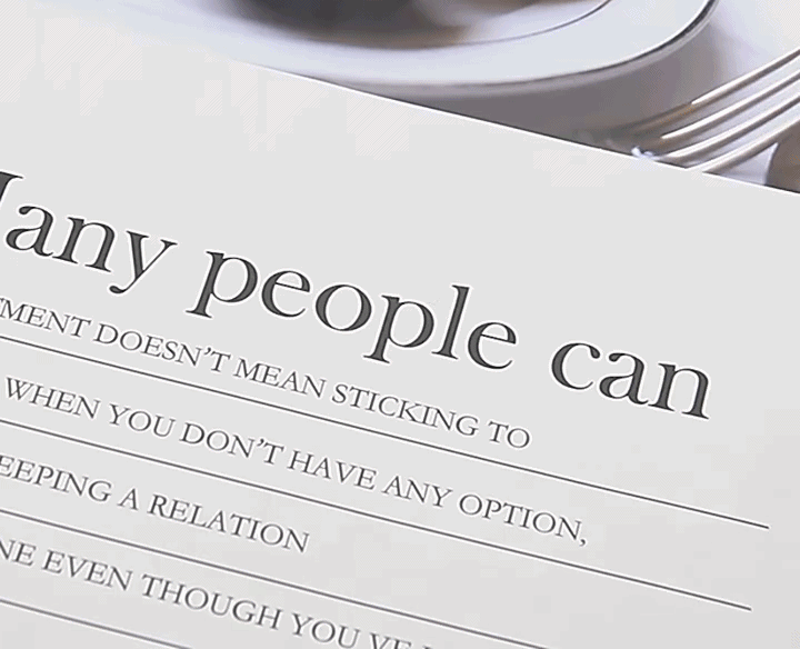 Rimless reading glasses with blush accent worn by model