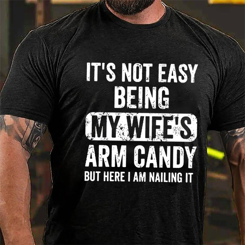 It's Not Easy Being My Wife's Arm Candy But Here I Am Nailing It Cotton T-shirt -Maturelion