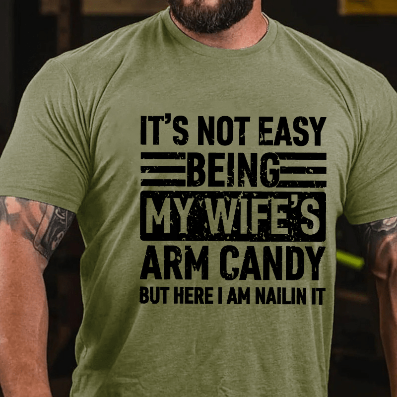 Maturelion It's Not Easy Being My Wife's Arm Candy But Here I'm Nailing It Cotton T-shirt (Free Customization)