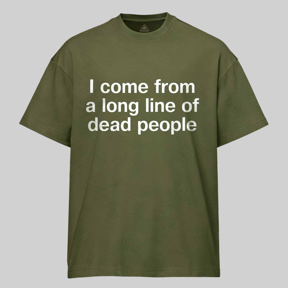 Maturelion I come from a long line of dead people" in plain white letters - dad jokes FTW Cotton T-shirt