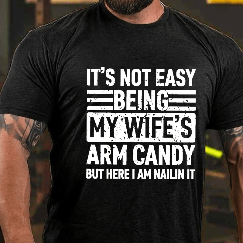 Maturelion It's Not Easy Being My Wife's Arm Candy But Here I'm Nailing It Cotton T-shirt (Free Customization)