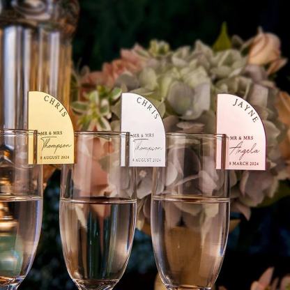 Personalized laser-engraved mirrored acrylic arched beverage labels, stirrers, place cards, wedding decorations, tableware, and party ornaments.