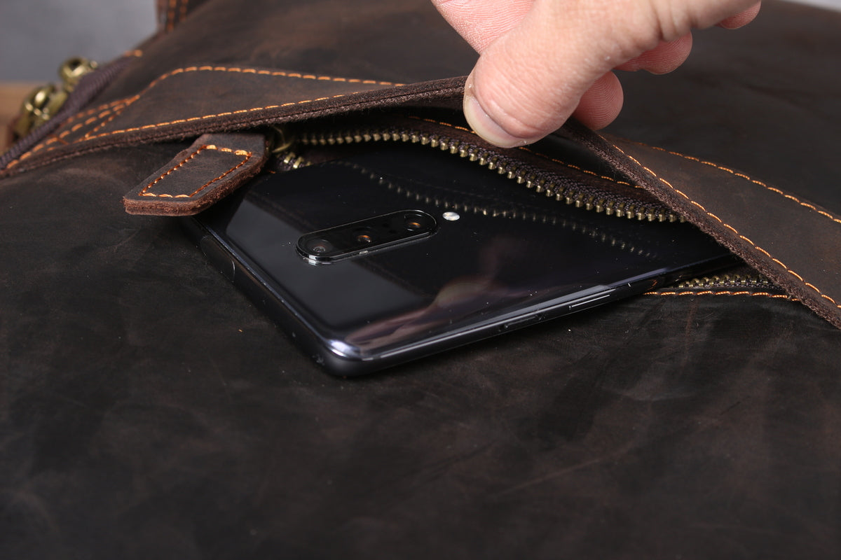 slim leather laptop book-bag with gold-tone brass hardware and metallic buckle