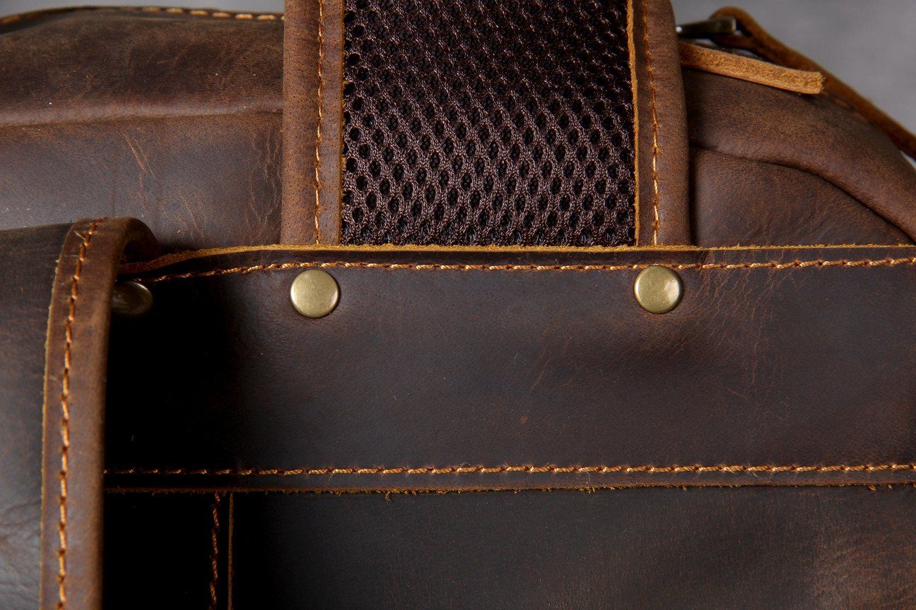 small book-bag leather with gold-tone brass hardware and metallic buckle