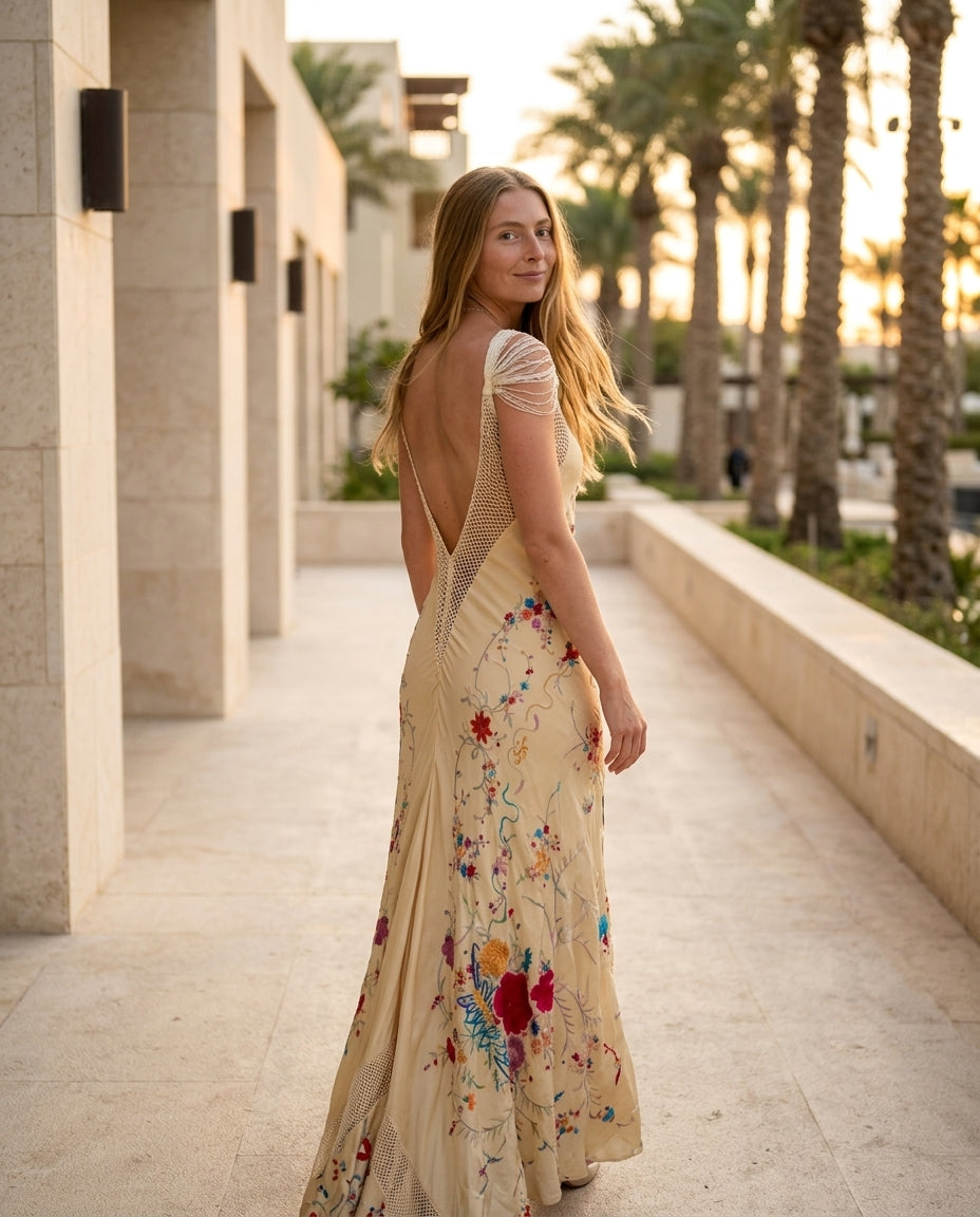 Ivory Gleam Evening Embroidered Maxi Dress Ivory Maxi Dress with Relaxed Fit silhouette and Textured texture, lifestyle scene image for Date Night, an estate dinner at golden hour, US East / Hamptons Elite by rumoved