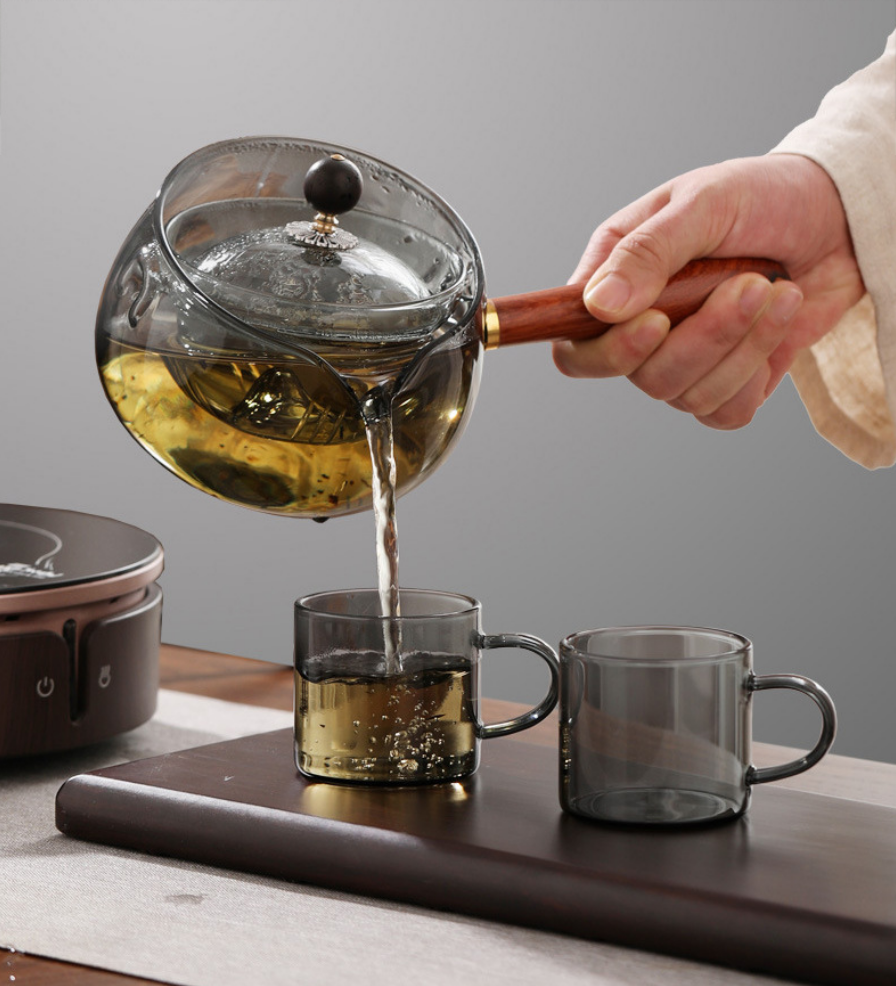 Hand-blown glass teapot with built-in infuser, suitable for use over an open flame