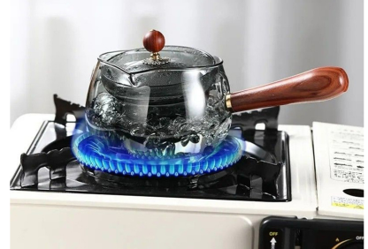 Hand-blown glass teapot with built-in infuser, suitable for use over an open flame