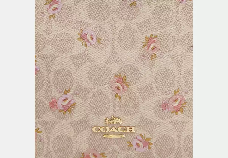 Slim Crossbody Bag In Signature Canvas With Floral Print