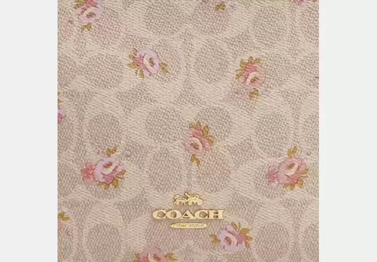 Slim Crossbody Bag In Signature Canvas With Floral Print