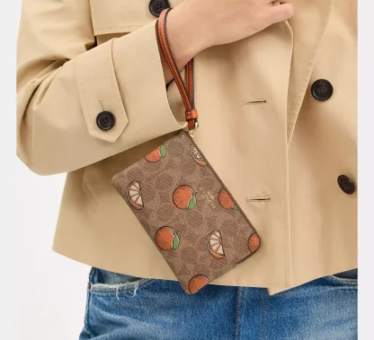 Corner Zip Wristlet In Signature Canvas With Orange Print