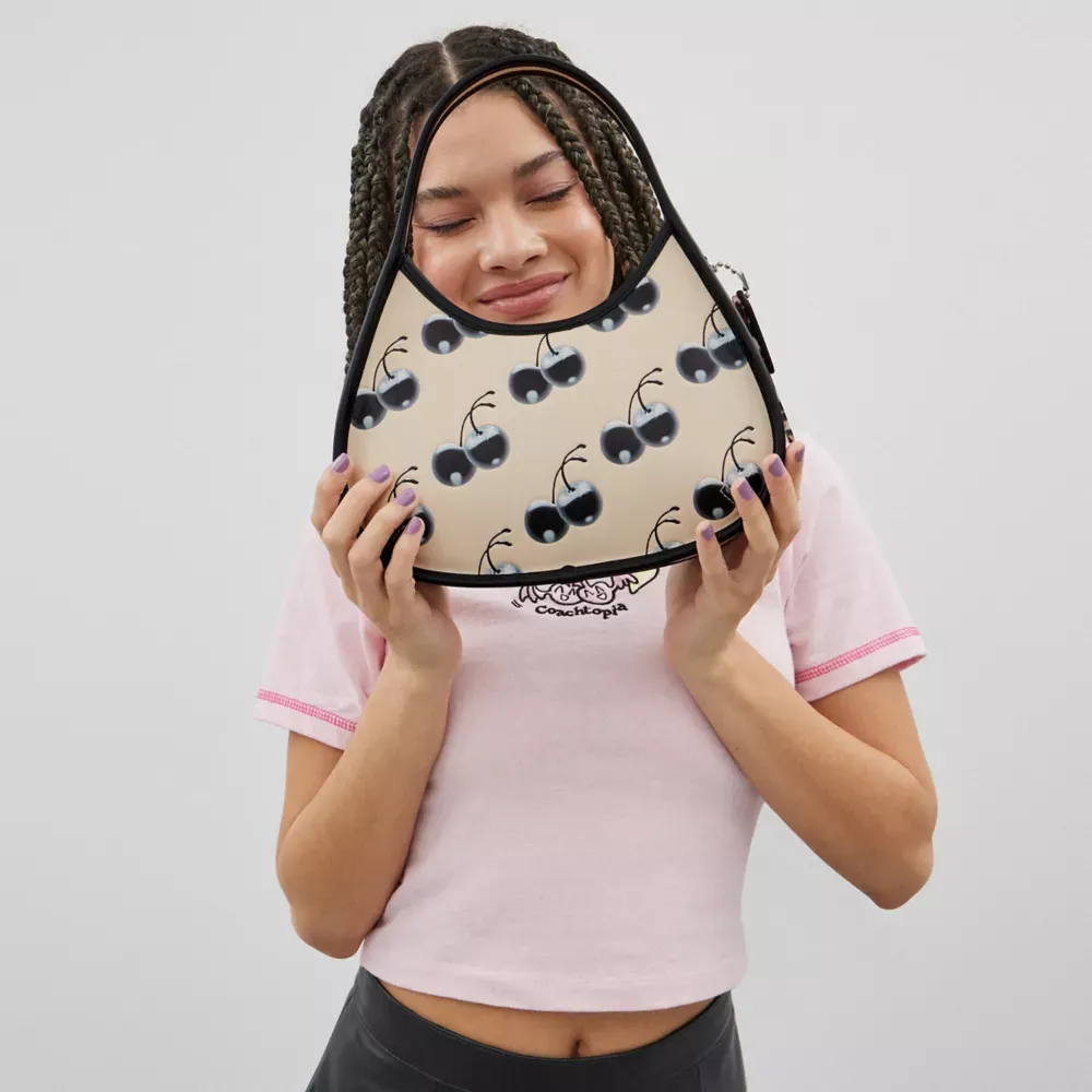 Ergo Bag In Coachtopia Leather With Cherry Print