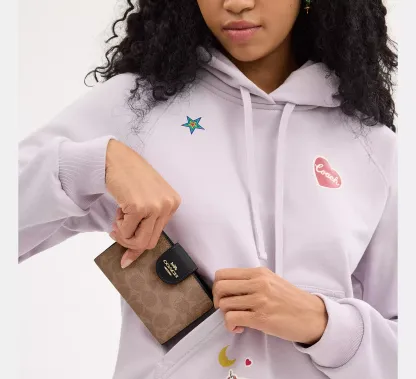 Medium Corner Zip Wallet In Signature Canvas