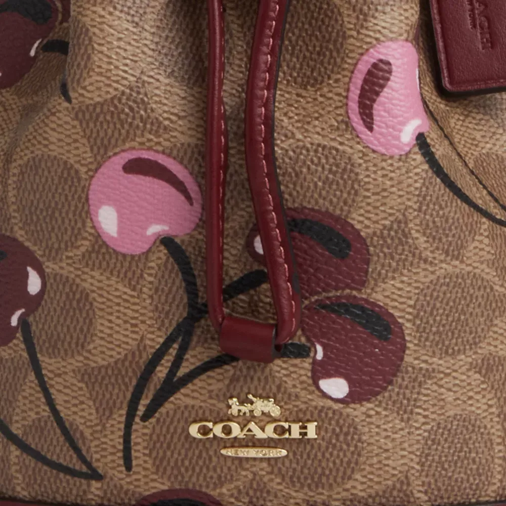 Mini Bucket Bag In Signature Canvas With Cherry Print