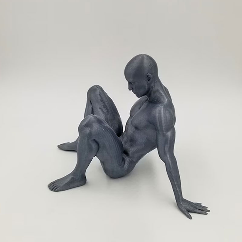 Nude Man Relaxing on Ground Sculpture