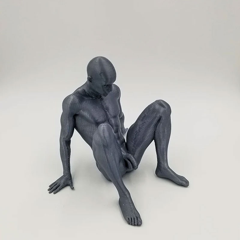 Nude Man Relaxing on Ground Sculpture