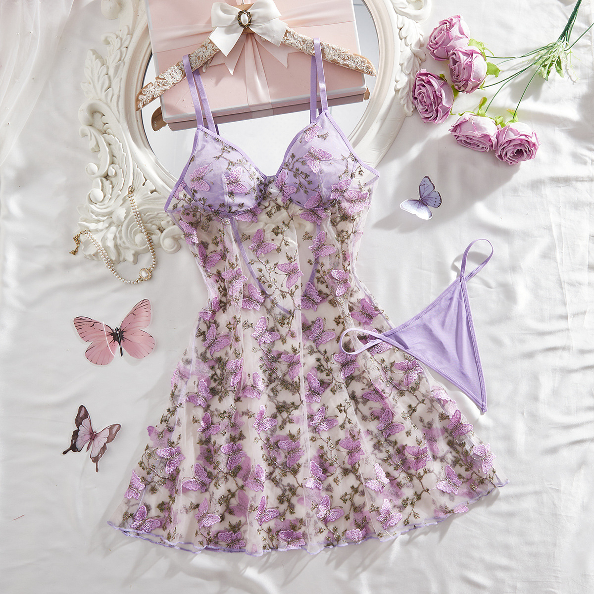 Sexy lingerie set with embroidery, camisole, short skirt, sheer nightgown and panties.