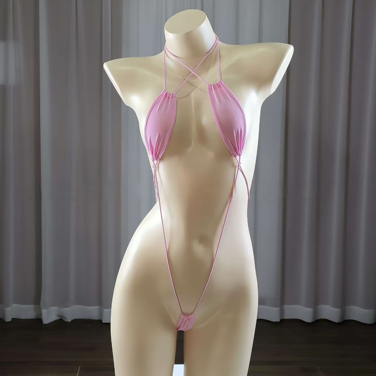 Sexy strappy women's lingerie set, seductive bodysuit.