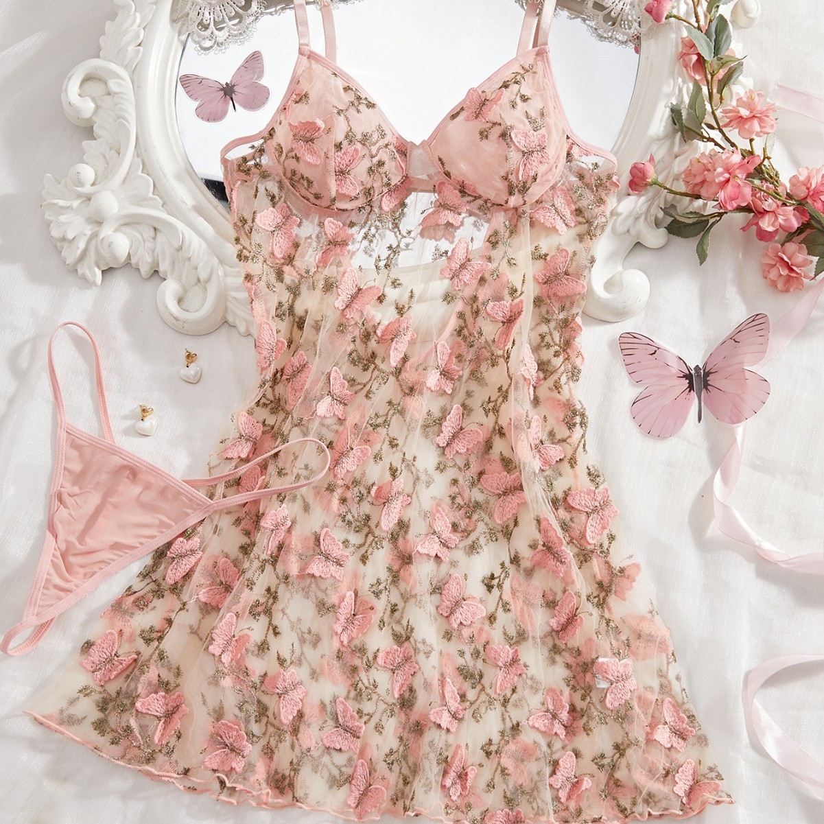Sexy lingerie set with embroidery, camisole, short skirt, sheer nightgown and panties.