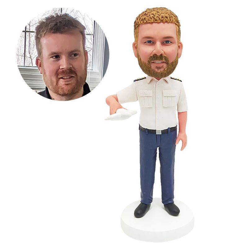 custom bobblehead figure pilot holding a plane model