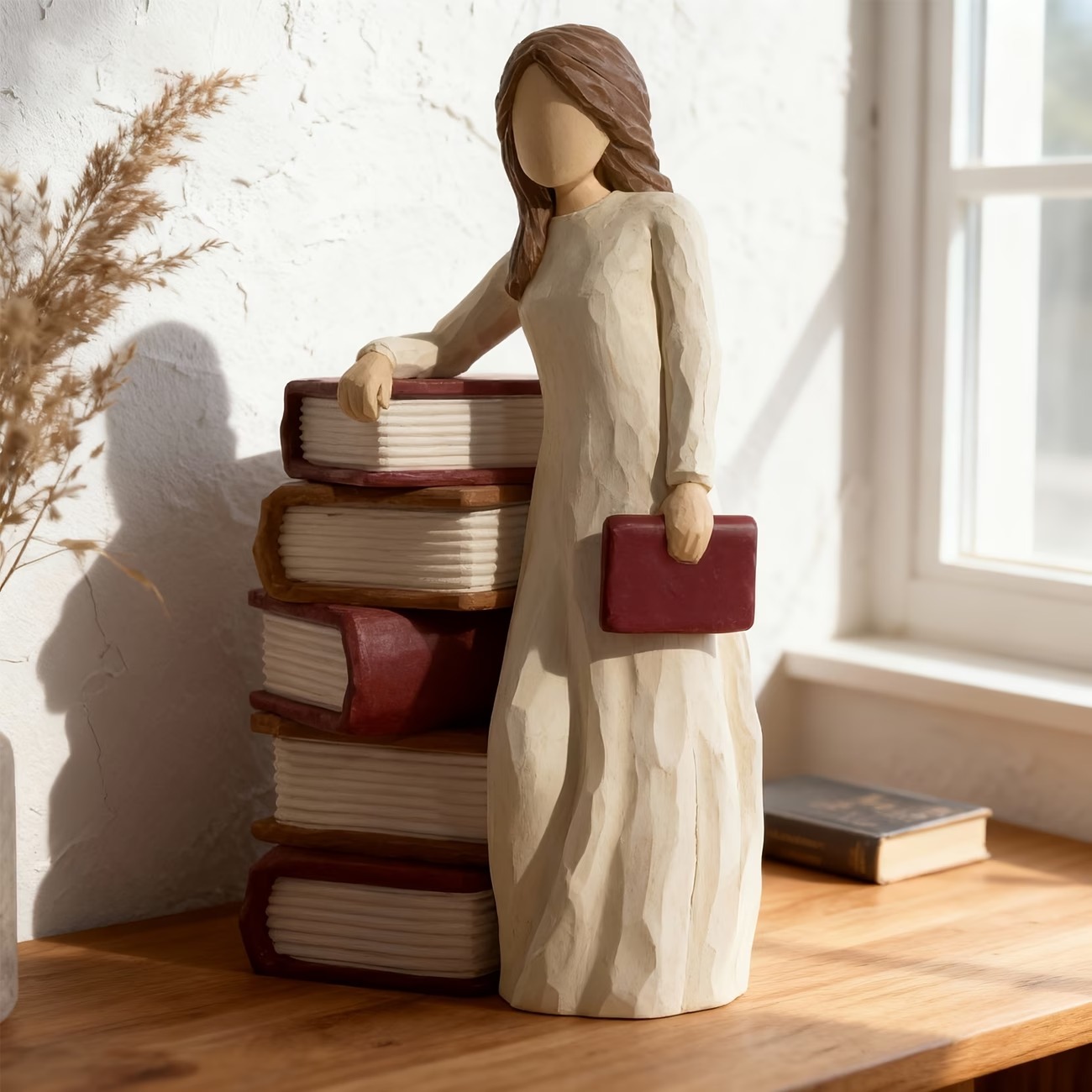 Charming Girl Holding Book Figurines