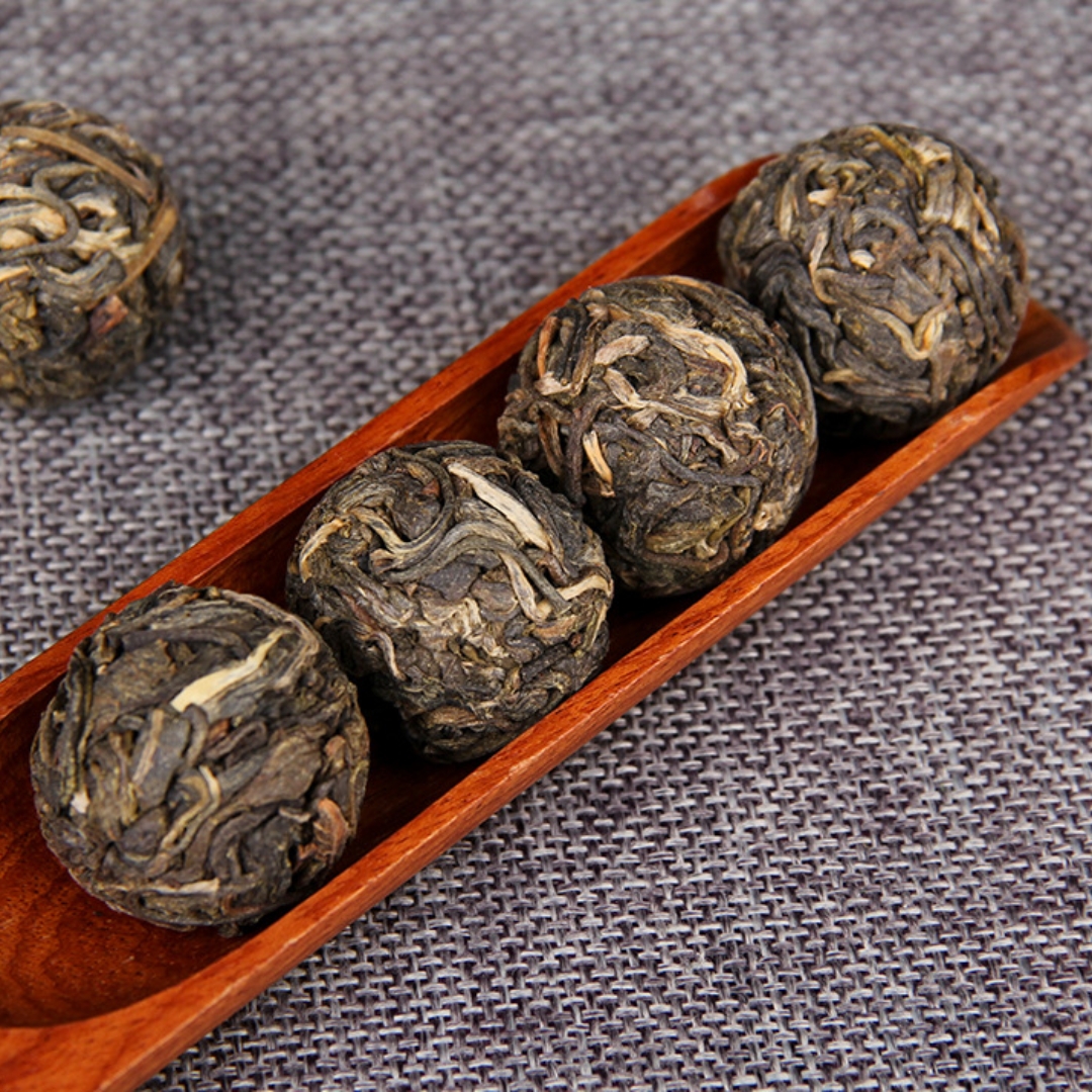 five pieces of raw Pu-erh tea balls