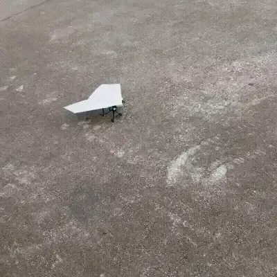 RC paper airplane flying outdoors