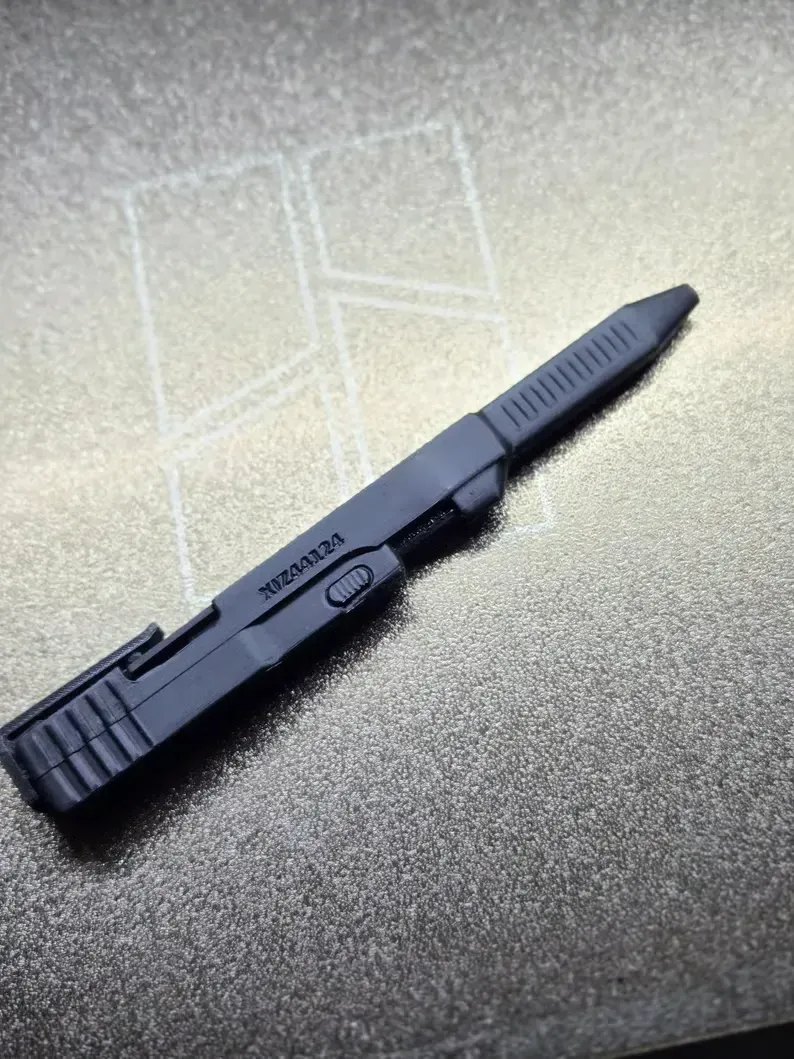 Close-up of black 3D-printed tactical-style ballpoint pen