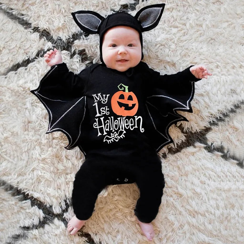 Baby wearing My First Halloween black bat costume