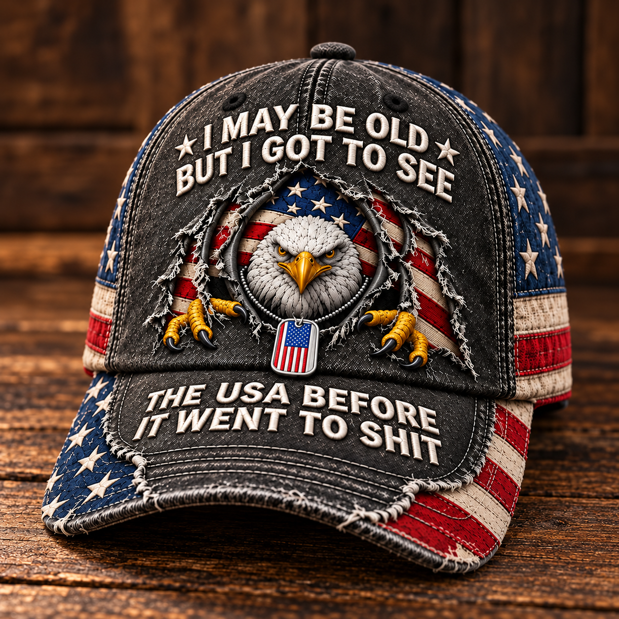 Distressed charcoal baseball cap featuring a bald eagle, American flag motifs and ivory lettering on the crown and brim