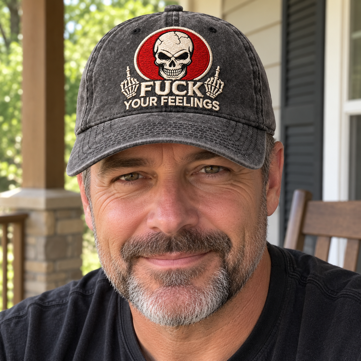 An adult man wearing the charcoal skull slogan cap with a casual dark shirt outdoors