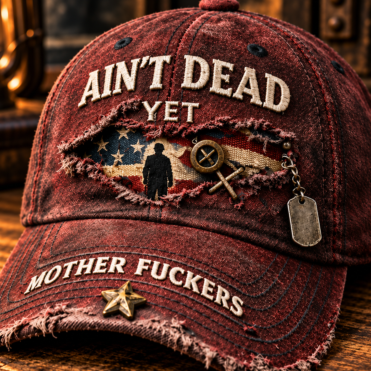 Close-up of the torn-look flag panel, standing silhouette, small emblem, silver chain and dog tag, brim star and lettering