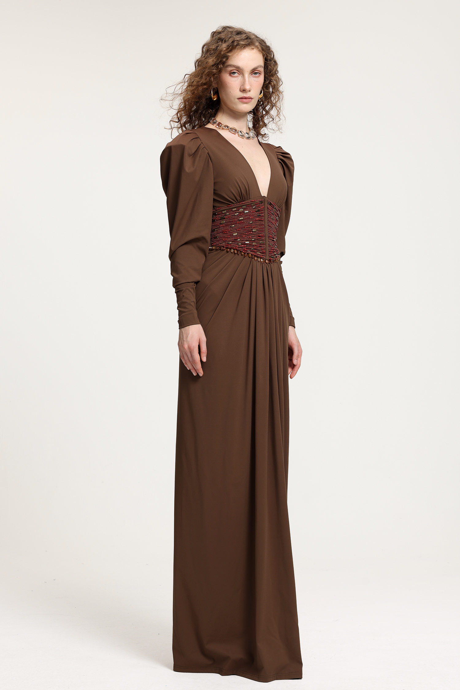 Brown Deep V-Neck Puffed Sleeve Gown With Red Beaded Corset Waist & Floor-Length Skirt