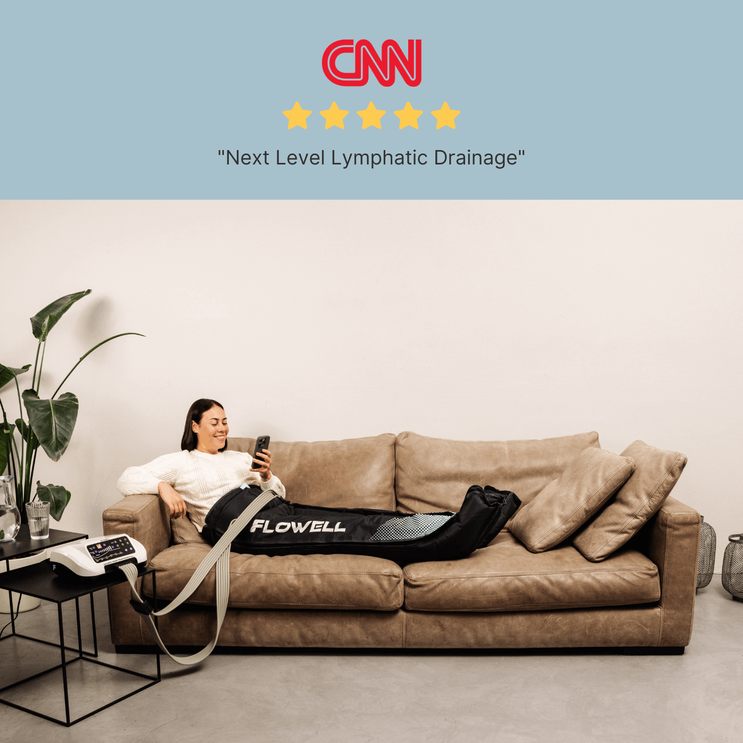 Flowell Home Deluxe Pants Set - Woman laying on couch wearing Flowell Home Deluxe Pants Set in black and light blue. "Next level Lymphatic Drainage" - CNN